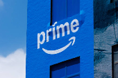 A downtown building is wrapped in Amazon Prime advertising, in San Diego