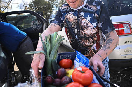 Food pantry is busy, weeks into the continuing U.S. government shutdown, in Fountain