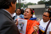 Family members of migrants imprisoned in El Salvador protest outside the United Nations building, in Caracas