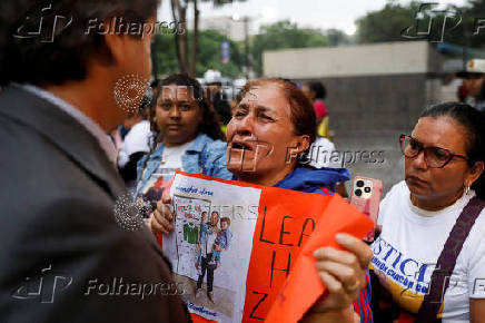Family members of migrants imprisoned in El Salvador protest outside the United Nations building, in Caracas