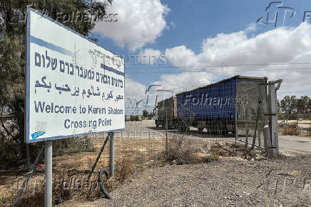 Trucks carrying aid are seen at the Kerem Shalom crossing between Israel and Gaza, on its Israeli side