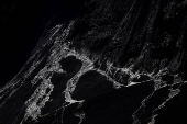 Debris and dust from a crumbling glacier that partially collapsed and tumbled onto the village of Blatten