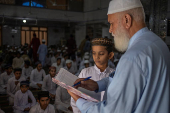 Pupils hold assembly ahead of classes at madrasa in Multan