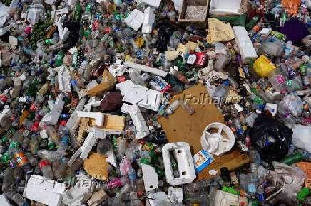 FILE PHOTO: Discarded plastics and other materials are collected at a barrier in the water that stops them from flowing into the sea in Colombo