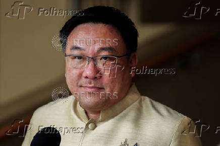Thailand's Deputy Finance Minister Julapun Amornvivat looks on as he speaks to media after a cabinet meeting at the Government House, in Bangkok