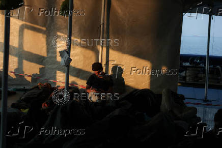 Rescued migrants arrive aboard Sea-Watch 5 ship in Salerno