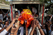 People load the body of Smit Parmar, who was killed in a suspected militant attack near Pahalgam in south Kashmir, into hearse for his last rites in Bhavnagar
