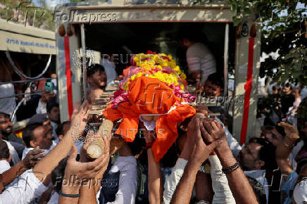 People load the body of Smit Parmar, who was killed in a suspected militant attack near Pahalgam in south Kashmir, into hearse for his last rites in Bhavnagar