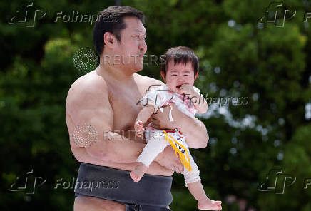 Babies take part in 'Nakizumo' or baby crying sumo contest at Senso-ji temple in Tokyo