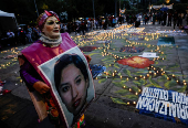 Family members and friends of missing persons participate in a candlelight vigil, in Mexico City