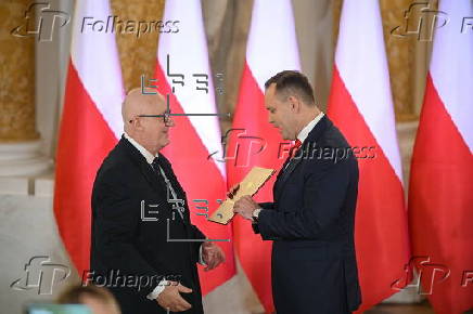Polish President-elect Karol Nawrocki receives the winning certificate