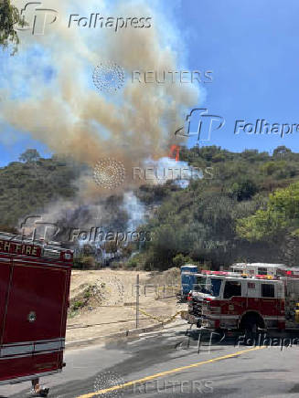 Fire and smoke rise during the Rancho Fire at Laguna Beach