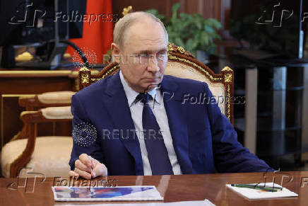 Russian President Vladimir Putin chairs a meeting on social issues, in Moscow