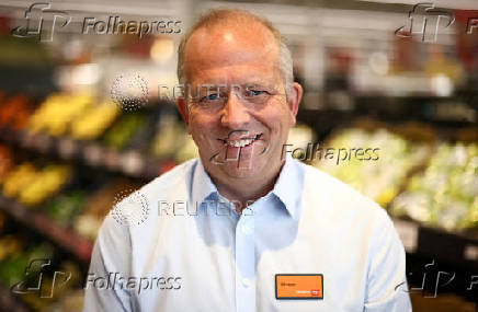 FILE PHOTO: Chief Executive Officer of Sainsbury's Simon Roberts poses inside a Sainsbury?s  supermarket in Richmond, west London