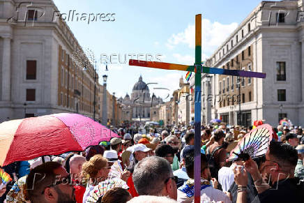 LGBTQ Pilgrims walk toward St. Peter's Basilica