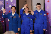 ISS crew departs the hotel for a pre-flight preparation, in Baikonur Cosmodrome