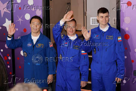 ISS crew departs the hotel for a pre-flight preparation, in Baikonur Cosmodrome