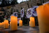 Family members and friends of missing persons participate in a candlelight vigil, in Mexico City