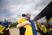 Ukrainian POWs are seen after a swap at an unknown location in Ukraine