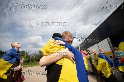 Ukrainian POWs are seen after a swap at an unknown location in Ukraine