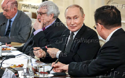 Russian President Vladimir Putin meets with heads of international news agencies in Saint Petersburg