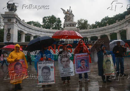 Demonstrators march to demand justice for the disappearance of students of Ayotzinapa Rural Teachers' College, in Mexico City