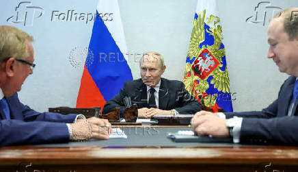 Russian President Vladimir Putin meets with VTB Bank President and Chairman of the United Shipbuilding Corporation Management Board Andrey Kostin and United Shipbuilding Corporation Director General Andrei Puchkov, in Severodvinsk