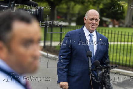 White House border czar Tom Homan talks with news media outside the White House