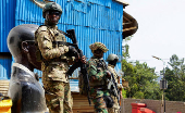 FILE PHOTO: Members of the M23 rebel group stand guard