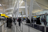 Travellers make their way to a security checkpoint at John F. Kennedy International Airport (JFK) in New York City