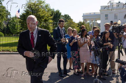 Border czar Tom Homan walks after speaking to reporters outside the West Wing of the White House in Washington, D.C.