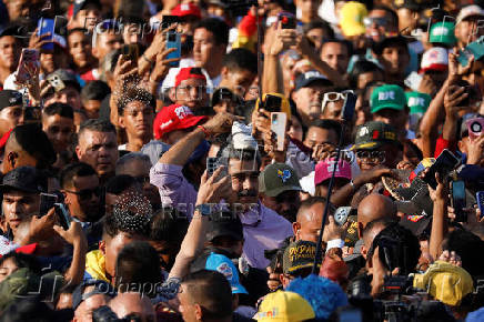Venezuela's President Maduro takes part in a march with young members of the United Socialist Party of Venezuela (PSUV) in Caracas