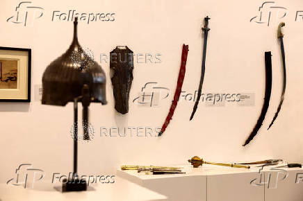 Swords, daggers and armours, including the ?World-Capturer? Sword of Shah Jahan, the blade dating to 17th century North India, are displayed at the Sotheby's, in Dubai