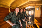 Members of the band KAJ pose in the sauna of the BastutiBasel fan project in Basel