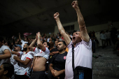 Jordanians celebrate a goal scored by their national football team against Oman as Jordan qualified for the World Cup for the first time after 3-0 win over Oman, in Amman