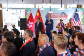 U.S. Consul General Gregory May and Hong Kong's Secretary for Commerce and Economic Development Algernon Yau Ying-wah listen to the U.S. National Anthem, in Hong Kong