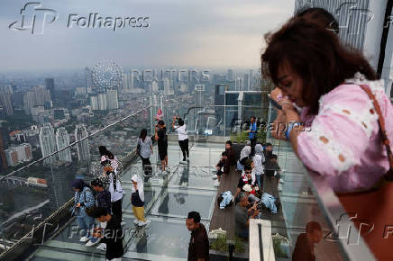 Visitors enjoy the UP sky garden view at Thamrin Nine building in Jakarta