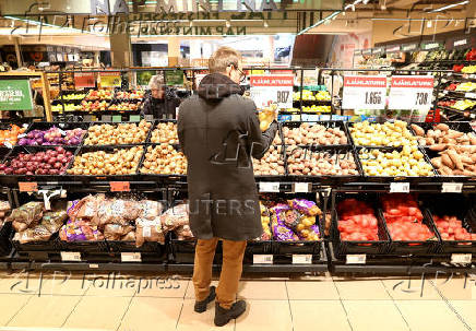 FILE PHOTO: A customer shops at a supermarket in Budapest
