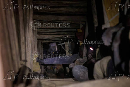 FILE PHOTO: FILE PHOTO: Miners work in the Rubaya coltan mine in Democratic Republic of Congo