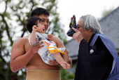 Babies take part in 'Nakizumo' or baby crying sumo contest at Senso-ji temple in Tokyo