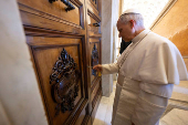 Pope Leo XIV unlocks the door to the Apostolic Palace after it was unsealed, at the Vatican