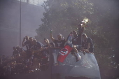 Players of Bologna FC and fans celebrate in Bologna
