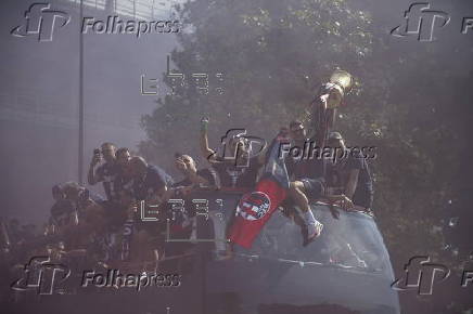 Players of Bologna FC and fans celebrate in Bologna