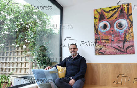 Palestinian-British chef Tamimi sits for portrait during interview with Reuters at his home in London