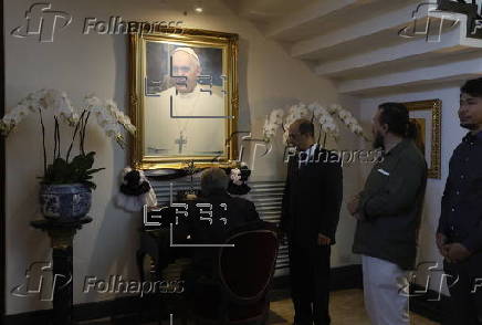 People sign condolence book at Vatican embassy in Bangkok following Pope Francis's death