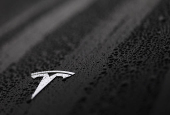 The logo of a Tesla is seen on a Tesla car in Brussels
