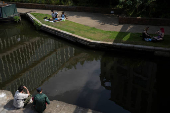People enjoy the weather by Regent?s Canal in London