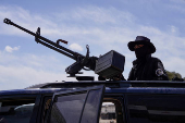 Syrian security forces deployed in the village of Al-Soura al-Kubra