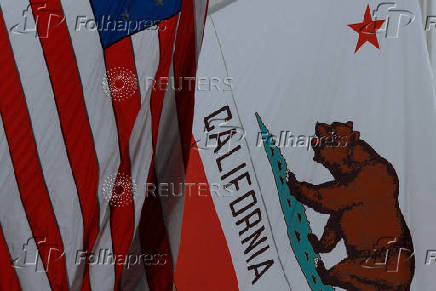 FILE PHOTO: U.S. and California state flag in San Diego