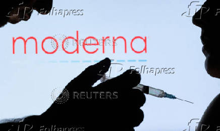 FILE PHOTO: People pose with syringe with needle in front of displayed Moderna logo